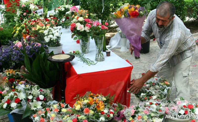 A Palestinian man participates in the opening of Palestinian agricultural festival at strawberry and roses , in the West Bank city of Nablus on May 23, 2012. Photo by Nedal Eshtayah