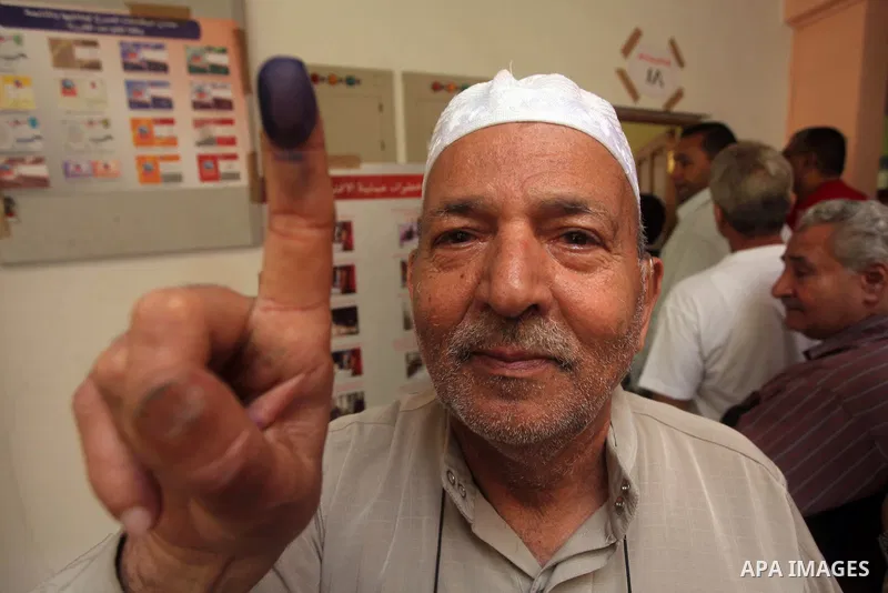 Egyptian man shows his ink-marked finger after casting his ballot during the first round of Egypt's presidential elections, at a polling station in Cairo, Egypt, 23 May 2012. Egyptian voters, on 23 May, queued at polling...