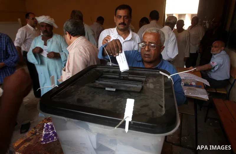 An Egyptian voter casts his ballots at one of the polling stations, on the first day of the presidential elections in Cairo, Egypt, 23 May 2012. Egyptian voters, on 23 May, queued at polling stations for the first Presid...