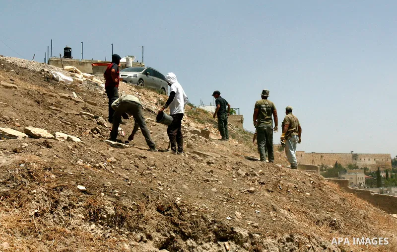 Workers build fake tombs at the alleged Jewish graves in a Palestinian area outside of Jerusalem in order to Judaize the area, in Valley Rababa, in Silwan Jerusalem's old city on May 24, 2012. Photo by Mahfouz Abu Turk