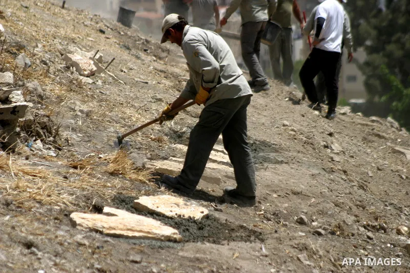 Workers build fake tombs at the alleged Jewish graves in a Palestinian area outside of Jerusalem in order to Judaize the area, in Valley Rababa, in Silwan Jerusalem's old city on May 24, 2012. Photo by Mahfouz Abu Turk