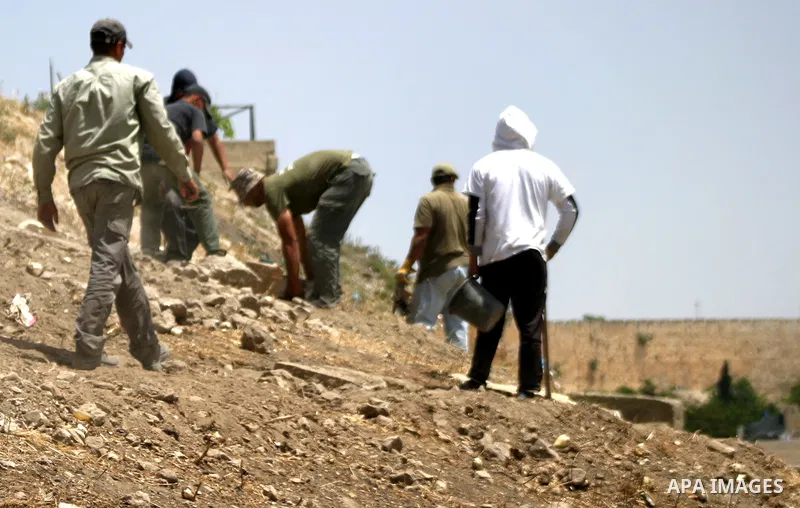 Workers build fake tombs at the alleged Jewish graves in a Palestinian area outside of Jerusalem in order to Judaize the area, in Valley Rababa, in Silwan Jerusalem's old city on May 24, 2012. Photo by Mahfouz Abu Turk