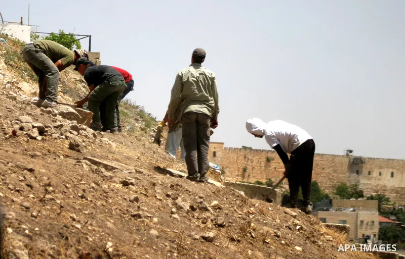 Workers build fake tombs at the alleged Jewish graves in a Palestinian area outside of Jerusalem in order to Judaize the area, in Valley Rababa, in Silwan Jerusalem's old city on May 24, 2012. Photo by Mahfouz Abu Turk