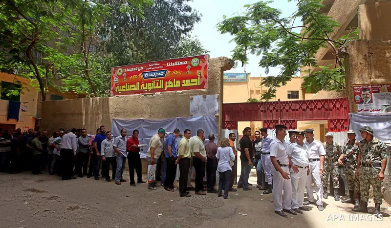 Egyptians wait to vote during second day of the first round of Egypt's presidential elections in Cairo, Egypt, 24 May 2012. Media reports quoting state-television and observers said that far less Egyptians turned out to...