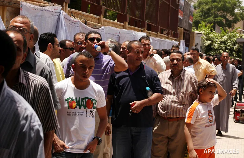 Egyptians wait to vote during second day of the first round of Egypt's presidential elections in Cairo, Egypt, 24 May 2012. Media reports quoting state-television and observers said that far less Egyptians turned out to...