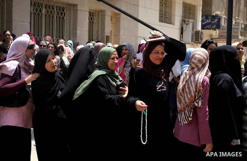 Egyptians wait to vote during second day of the first round of Egypt's presidential elections in Cairo, Egypt, 24 May 2012. Media reports quoting state-television and observers said that far less Egyptians turned out to...