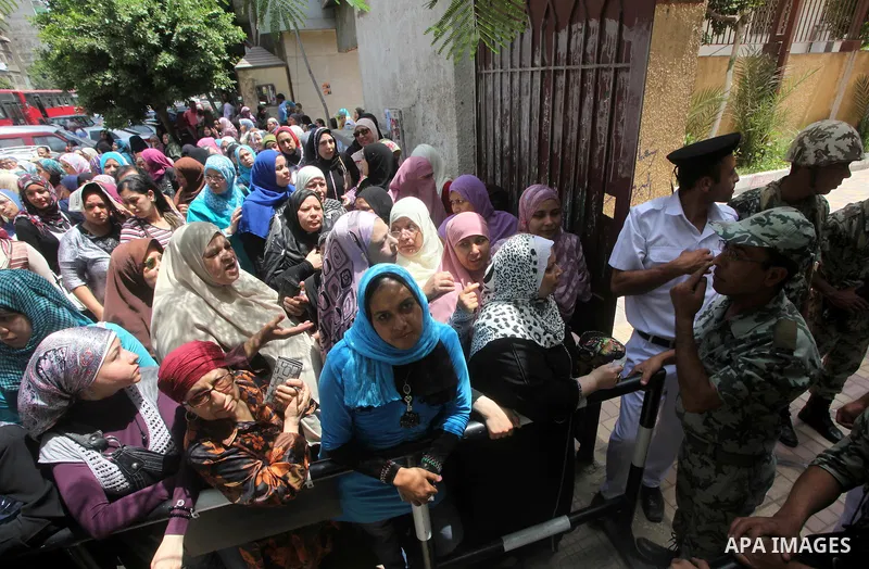 Egyptians wait to vote during second day of the first round of Egypt's presidential elections in Cairo, Egypt, 24 May 2012. Media reports quoting state-television and observers said that far less Egyptians turned out to...