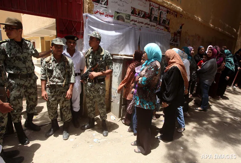 Egyptians wait to vote during second day of the first round of Egypt's presidential elections in Cairo, Egypt, 24 May 2012. Media reports quoting state-television and observers said that far less Egyptians turned out to...