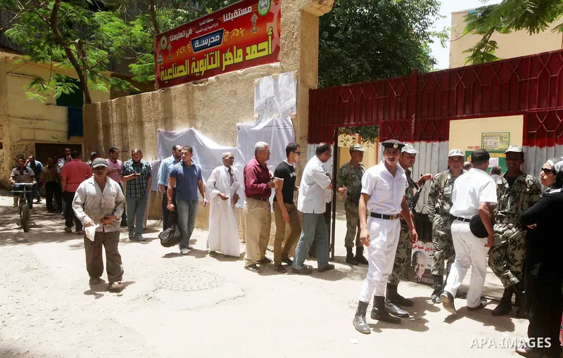 Egyptians wait to vote during second day of the first round of Egypt's presidential elections in Cairo, Egypt, 24 May 2012. Media reports quoting state-television and observers said that far less Egyptians turned out to...