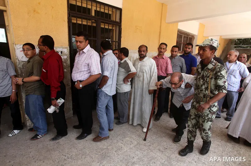 Egyptians wait to vote during second day of the first round of Egypt's presidential elections in Cairo, Egypt, 24 May 2012. Media reports quoting state-television and observers said that far less Egyptians turned out to...