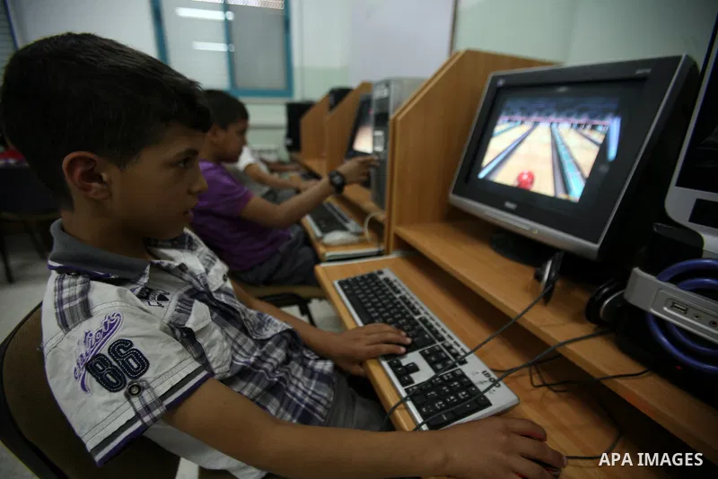 Palestinian orphan children learn computer skils at the Hebron's orphan house, in the West Bank city of Hebron 24 May 2012. Hebron's orphan house contain about 100 orphan children from ages 6 to 18 years old, and oversee...