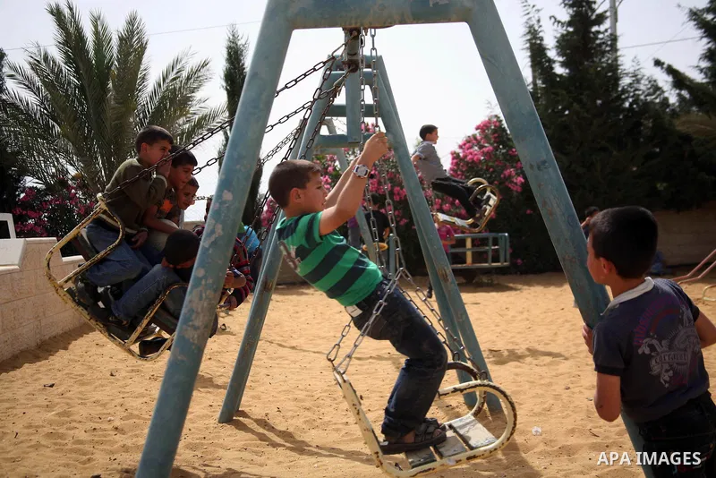 Palestinian orphan children play at the Hebron's orphan house, in the West Bank city of Hebron 24 May 2012. Hebron's orphan house contain about 100 orphan children from ages 6 to 18 years old, and oversees some of orphan...