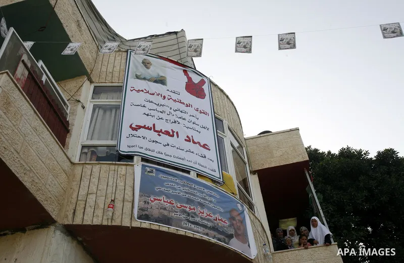 A Palestinian freed prisoner, Emad EL-Abasi, is welcomed by his relatives in the east Jerusalem neighborhood of Silwan on May 24, 2012. after he was released from an Israeli jails. Photo by Mahfouz Abu Turk