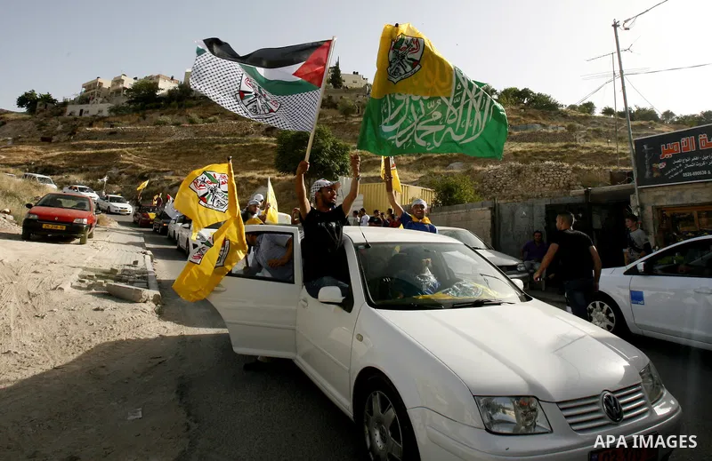 A Palestinian freed prisoner, Emad EL-Abasi, is welcomed by his relatives in the east Jerusalem neighborhood of Silwan on May 24, 2012. after he was released from an Israeli jails. Photo by Mahfouz Abu Turk