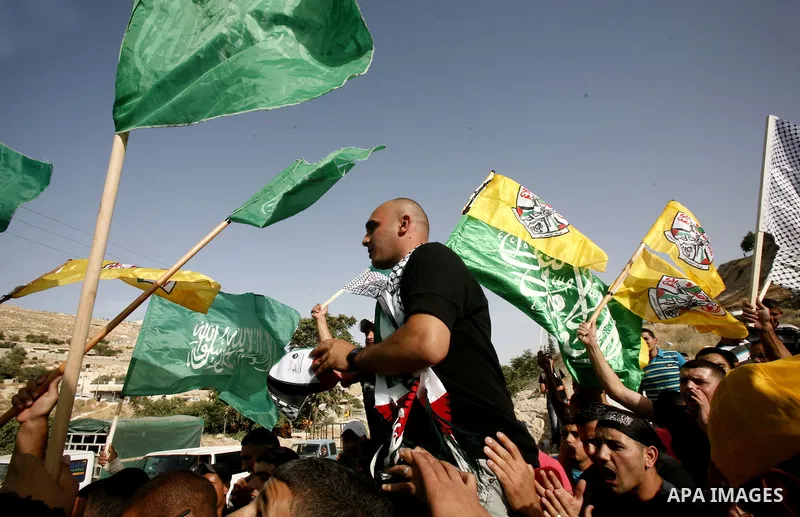 A Palestinian freed prisoner, Emad EL-Abasi, is welcomed by his relatives in the east Jerusalem neighborhood of Silwan on May 24, 2012. after he was released from an Israeli jails. Photo by Mahfouz Abu Turk