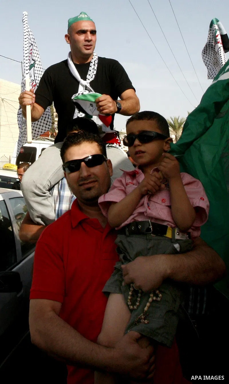 A Palestinian freed prisoner, Emad EL-Abasi, is welcomed by his relatives in the east Jerusalem neighborhood of Silwan on May 24, 2012. after he was released from an Israeli jails. Photo by Mahfouz Abu Turk