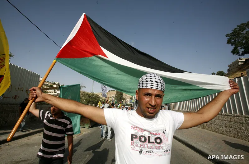 A Palestinian freed prisoner, Emad EL-Abasi, is welcomed by his relatives in the east Jerusalem neighborhood of Silwan on May 24, 2012. after he was released from an Israeli jails. Photo by Mahfouz Abu Turk