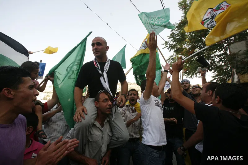 A Palestinian freed prisoner, Emad EL-Abasi, is welcomed by his relatives in the east Jerusalem neighborhood of Silwan on May 24, 2012. after he was released from an Israeli jails. Photo by Mahfouz Abu Turk