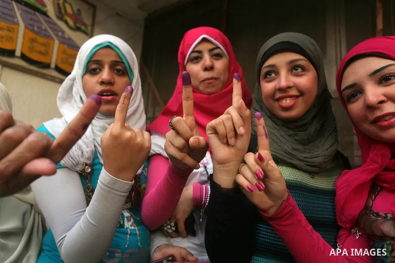 Egyptian women show thier ink-marked finger after casting thier ballot during the first round of Egypt's presidential elections, at a polling station in Cairo, Egypt, 24 May 2012. for the first Presidential election sinc...