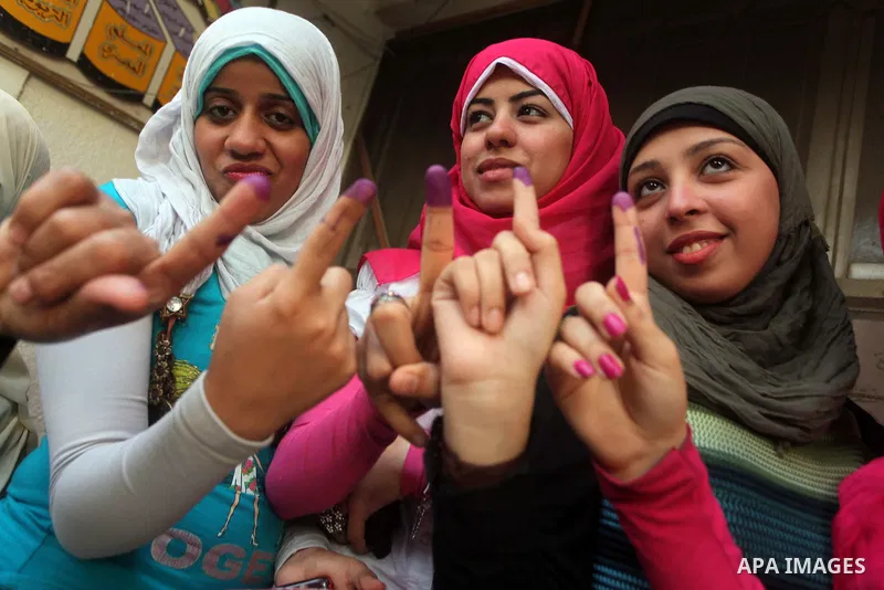 Egyptian women show thier ink-marked finger after casting thier ballot during the first round of Egypt's presidential elections, at a polling station in Cairo, Egypt, 24 May 2012. for the first Presidential election sinc...