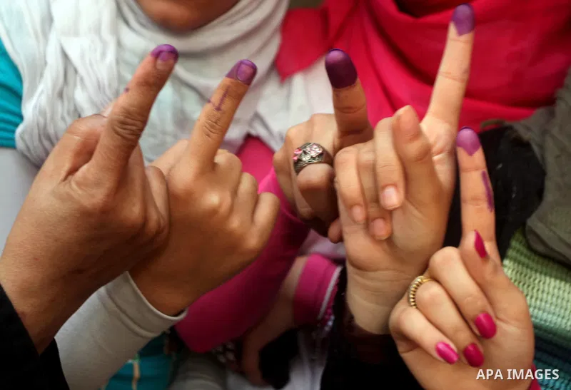 Egyptian women show thier ink-marked finger after casting thier ballot during the first round of Egypt's presidential elections, at a polling station in Cairo, Egypt, 24 May 2012. for the first Presidential election sinc...