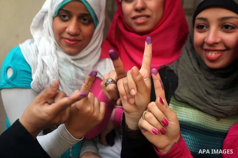 Egyptian women show thier ink-marked finger after casting thier ballot during the first round of Egypt's presidential elections, at a polling station in Cairo, Egypt, 24 May 2012. for the first Presidential election sinc...