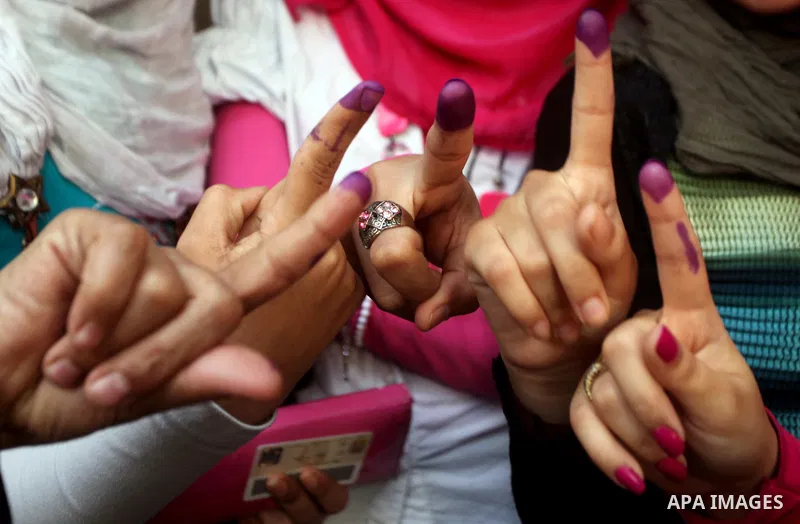 Egyptian women show thier ink-marked finger after casting thier ballot during the first round of Egypt's presidential elections, at a polling station in Cairo, Egypt, 24 May 2012. for the first Presidential election sinc...