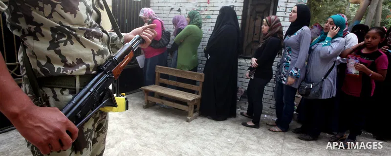 Voters wait outside a polling station in Cairo during presidential elections May 24, 2012. Egypt resumes its first free presidential election on Thursday after voting passed off mostly calmly on the first day apart from...