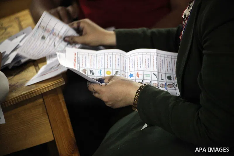 Egyptian election officials count ballots of the first round of Egypt's presidential elections, in a polling station in Cairo, Egypt, at the end of the election's second day on 24 May 2012. Polling stations closed at 9 p...