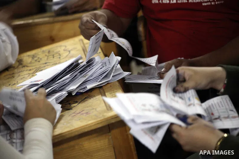 Egyptian election officials count ballots of the first round of Egypt's presidential elections, in a polling station in Cairo, Egypt, at the end of the election's second day on 24 May 2012. Polling stations closed at 9 p...