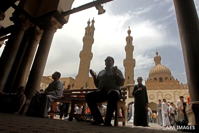 Egyptians attend friday prayers at Al Azhar Mosque in cairo city, 25 May 2012. Many residents and voters now wait in anticipation of the results. following the excitement of casting votes in Egypt's first legitimate demo...