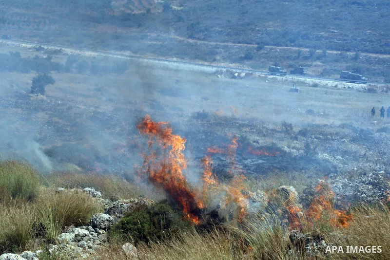 Israeli soldiers fire tear gas at Palestinian protesters during clashes between stone throwers and Israeli soldiers in the West Bank village of Nabi Saleh, near Ramallah, on May 25, 2012 following a protest against the c...