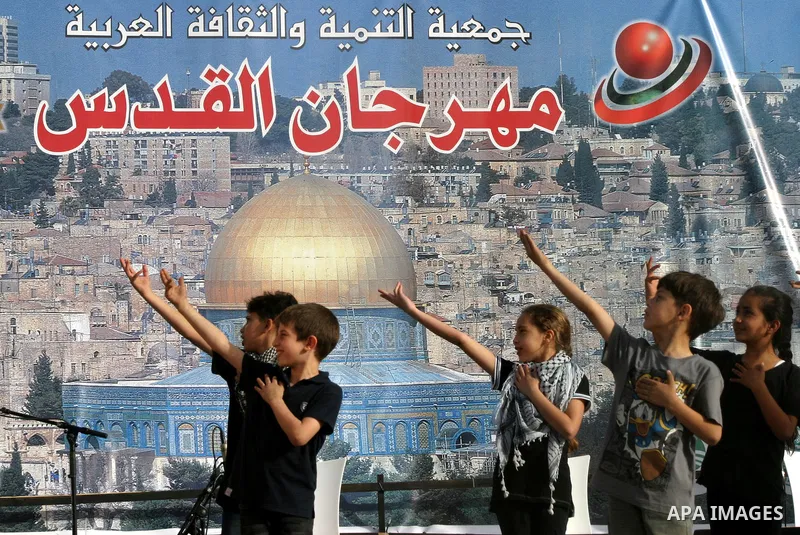 A Palestinian folkloric dance troupe performs during a celebration in Arab east jerusalem after the longest buffet of natural and organic food registered a new Guinness world record, on May 26, 2012 in Arab east jerusale...