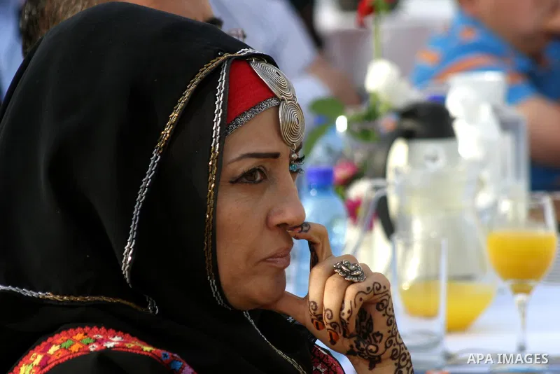 Palestinians participate a celebration in Arab east jerusalem after the longest buffet of natural and organic food registered a new Guinness world record. -- Palestinians serve food from the longest buffet table of natur...