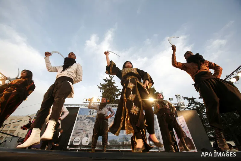 A Palestinian folkloric dance troupe performs during a celebration in Arab east jerusalem after the longest buffet of natural and organic food registered a new Guinness world record, on May 26, 2012 in Arab east jerusale...