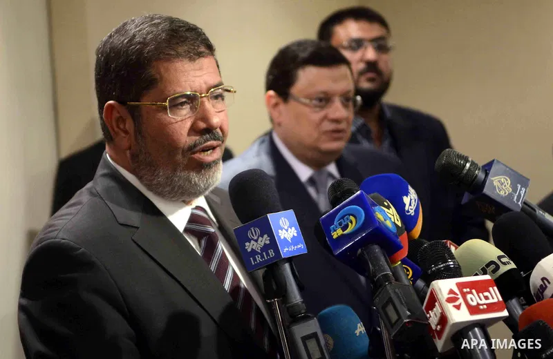Muslim Brotherhood Egyptian presidential candidate Mohammed Mursi gives a press conference in Cairo on May 26, 2012. The Muslim Brotherhood today urged Egyptians to rally behind their presidential candidate in an almost...