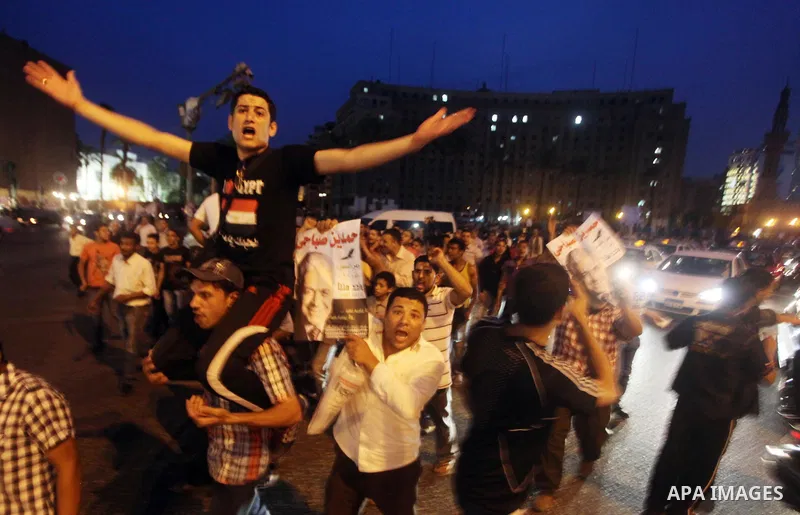 Egyptian protesters shout slogans during a protest against candidate Ahmed Shafiq and support candidate Hamdeen Sabahi, at Tahrir Square in Cairo May 27, 2012. The prospect of Shafiq succeeding Hosni Mubarak as president...