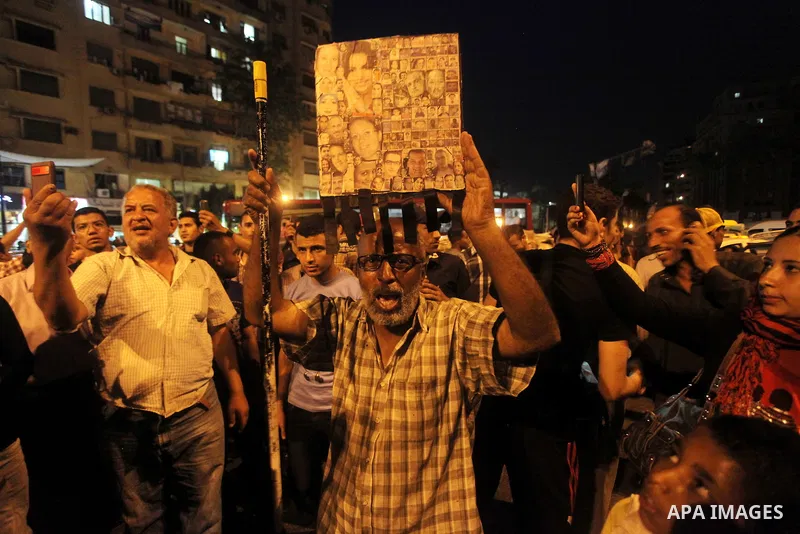 Egyptian protesters shout slogans during a protest against candidate Ahmed Shafiq and support candidate Hamdeen Sabahi, at Tahrir Square in Cairo May 27, 2012. The prospect of Shafiq succeeding Hosni Mubarak as president...