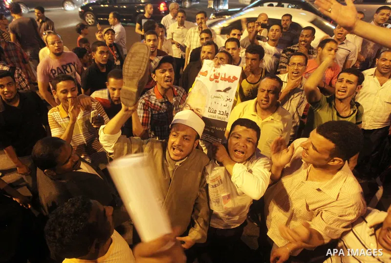 Egyptian protesters shout slogans during a protest against candidate Ahmed Shafiq and support candidate Hamdeen Sabahi, at Tahrir Square in Cairo May 27, 2012. The prospect of Shafiq succeeding Hosni Mubarak as president...