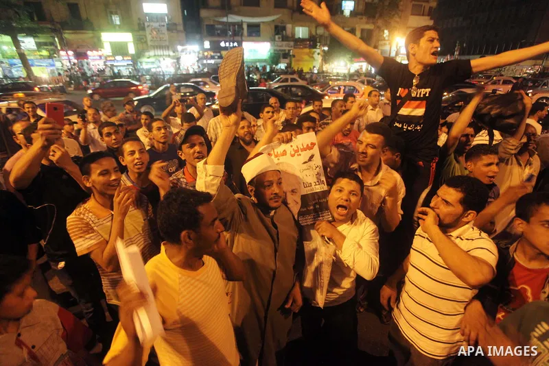 Egyptian protesters shout slogans during a protest against candidate Ahmed Shafiq and support candidate Hamdeen Sabahi, at Tahrir Square in Cairo May 27, 2012. The prospect of Shafiq succeeding Hosni Mubarak as president...