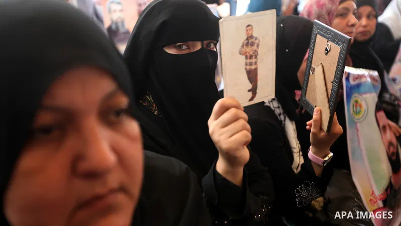Relatives of Palestinian prisoners participate a protest at the Red Cross' offices in Gaza City to call for the release of Palestinian prisoners held in Israeli jails, on May. 28, 2012. Photo by Majdi Fathi