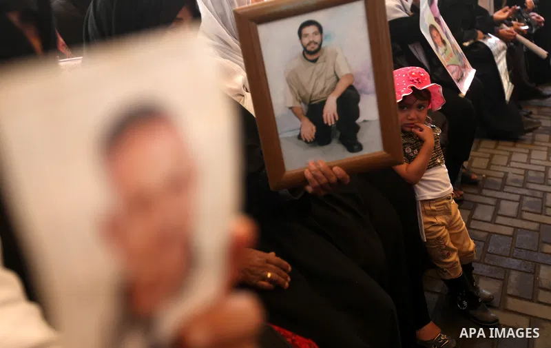 Relatives of Palestinian prisoners participate a protest at the Red Cross' offices in Gaza City to call for the release of Palestinian prisoners held in Israeli jails, on May. 28, 2012. Photo by Majdi Fathi