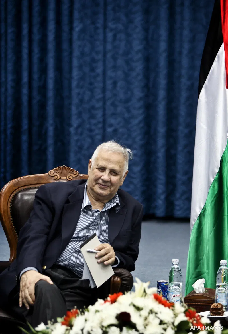 The head of Gaza's Hamas government, Ismail Haniya (C-R), meets with members of the Central Elections Commission in Gaza City on May 28, 2012 as CEC officials prepare to begin work on updating the electoral register in t...