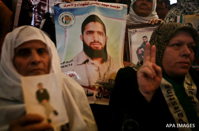 Relatives of Palestinian prisoners participate a protest at the Red Cross' offices in Gaza City to call for the release of Palestinian prisoners held in Israeli jails, on May. 28, 2012. Photo by Ali Jadallah