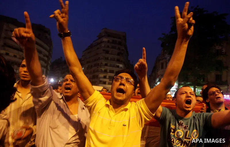 A youth takes part in a demonstration in Tahrir Square to protest the outcome of the Egyptian presidential election, Cairo, Egypt, Monday May 28, 2012. The runoff vote for Egypt's next president will pit the Muslim Broth...