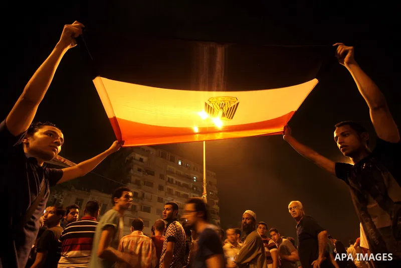 A youth takes part in a demonstration in Tahrir Square to protest the outcome of the Egyptian presidential election, Cairo, Egypt, Monday May 28, 2012. The runoff vote for Egypt's next president will pit the Muslim Broth...