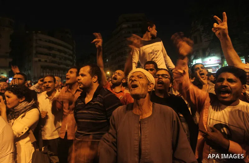 A youth takes part in a demonstration in Tahrir Square to protest the outcome of the Egyptian presidential election, Cairo, Egypt, Monday May 28, 2012. The runoff vote for Egypt's next president will pit the Muslim Broth...