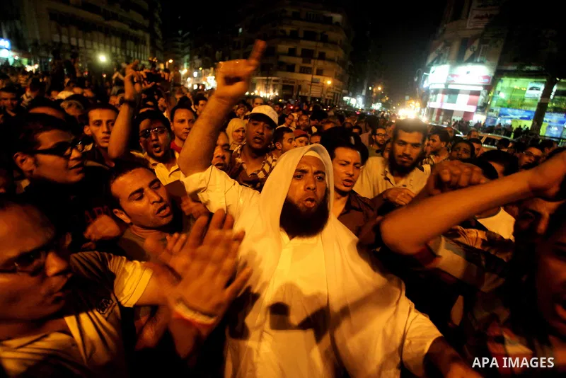 A youth takes part in a demonstration in Tahrir Square to protest the outcome of the Egyptian presidential election, Cairo, Egypt, Monday May 28, 2012. The runoff vote for Egypt's next president will pit the Muslim Broth...