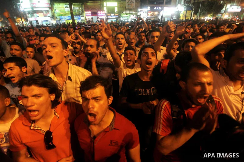 A youth takes part in a demonstration in Tahrir Square to protest the outcome of the Egyptian presidential election, Cairo, Egypt, Monday May 28, 2012. The runoff vote for Egypt's next president will pit the Muslim Broth...