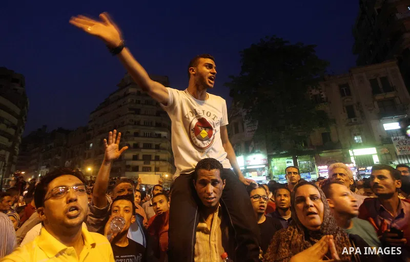 A youth takes part in a demonstration in Tahrir Square to protest the outcome of the Egyptian presidential election, Cairo, Egypt, Monday May 28, 2012. The runoff vote for Egypt's next president will pit the Muslim Broth...